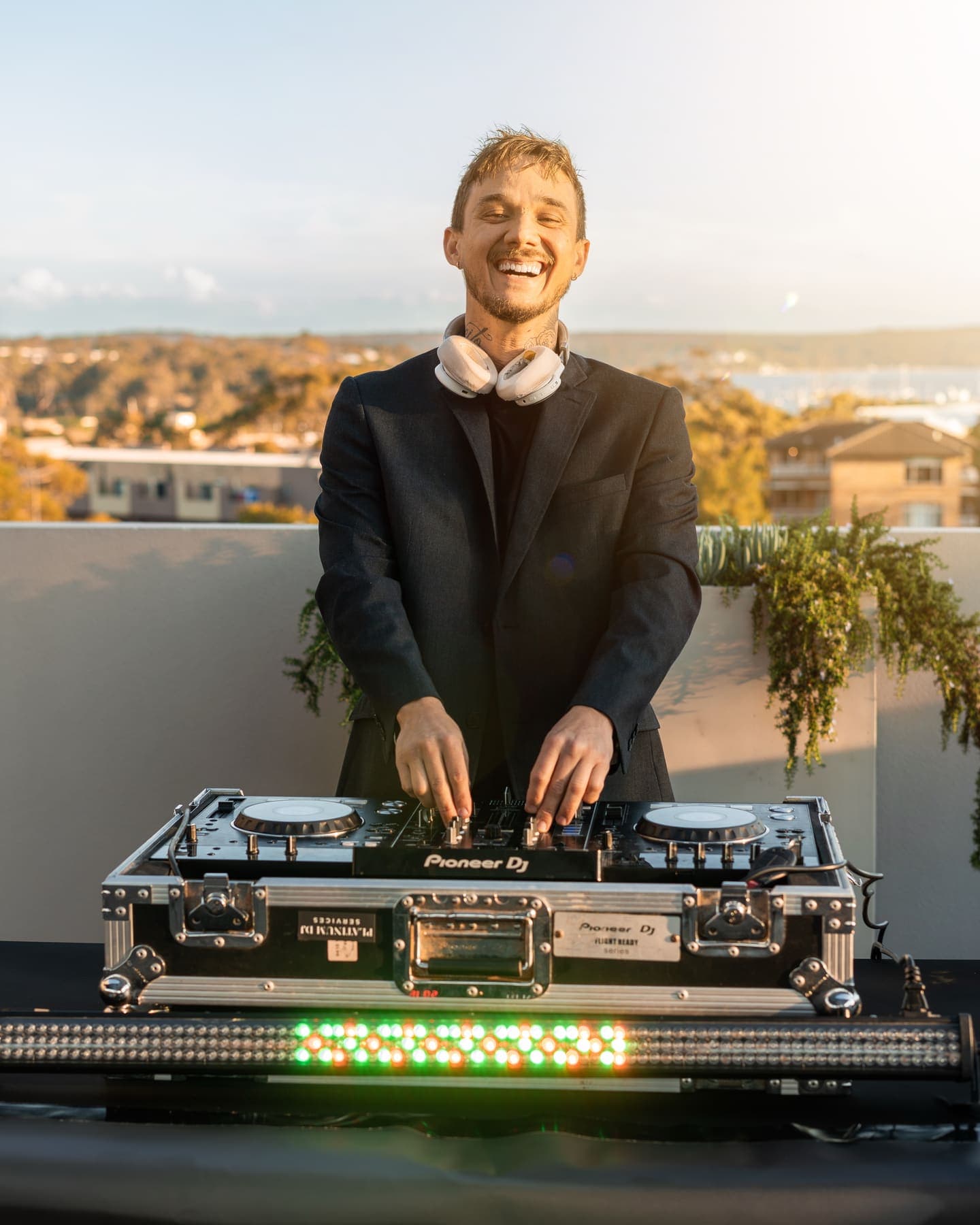 Platinum DJ Andre playing a rooftop venue at sunset