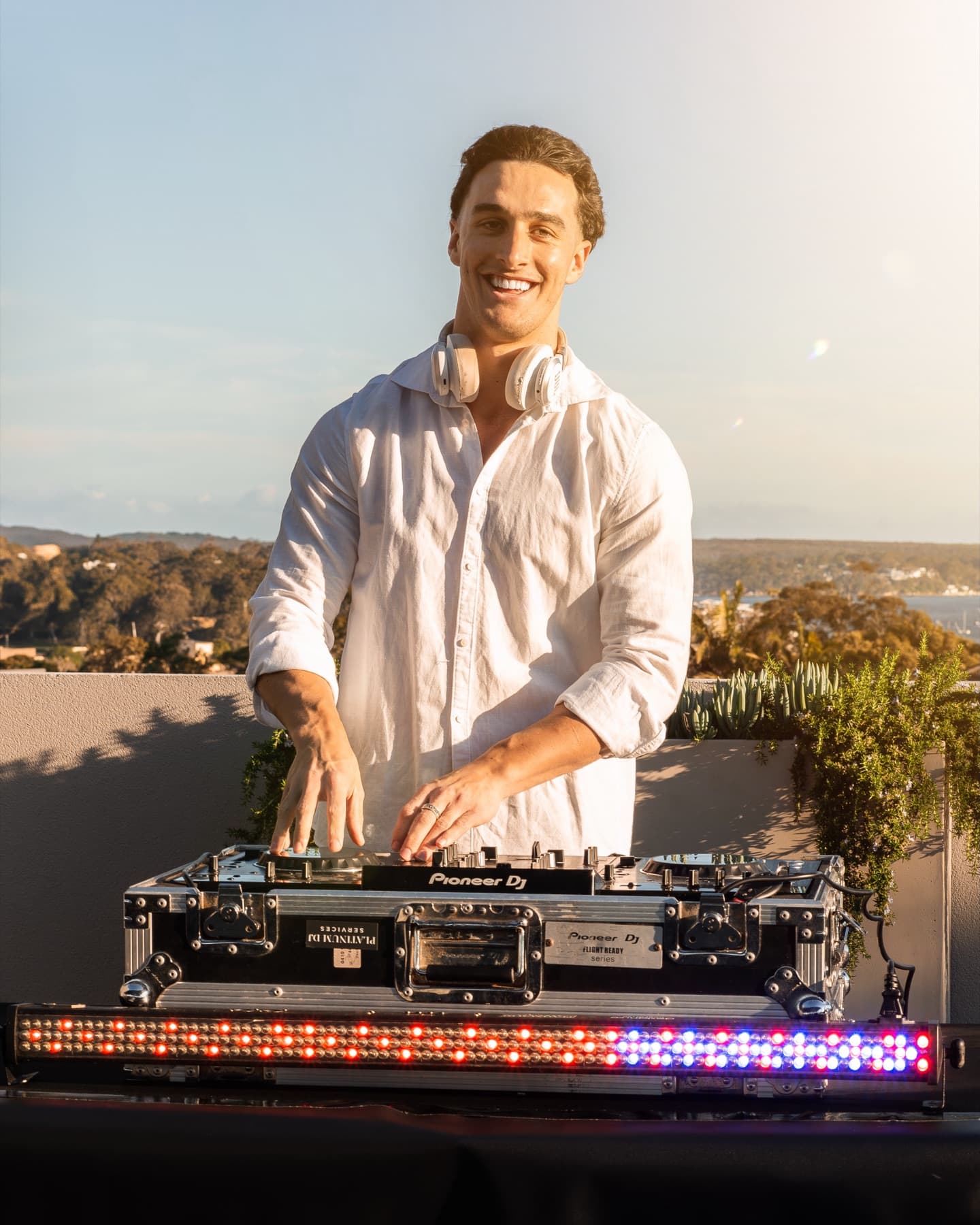 Platinum DJ Jack performing at a rooftop event